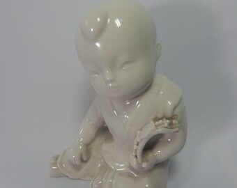 Antique Chinoiserie blanc de chine Dehua white porcelain boy figurine Qing Dynasty