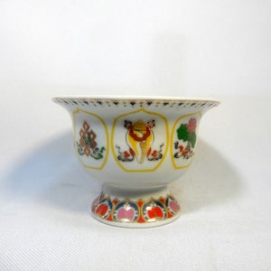 Vintage Tibetan offering porcelain cup bowl with Eight Auspicious Symbols