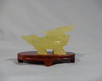 Antique hand harved xui jade mythological animal wood stand circa 1950s unused