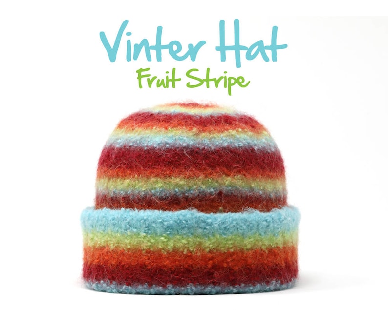 May include: A colorful striped winter hat with red, orange, yellow, green, and blue stripes. The hat is made of a soft, fuzzy material. "Winter Hat Fruit Stripe" is written in blue text above the hat.