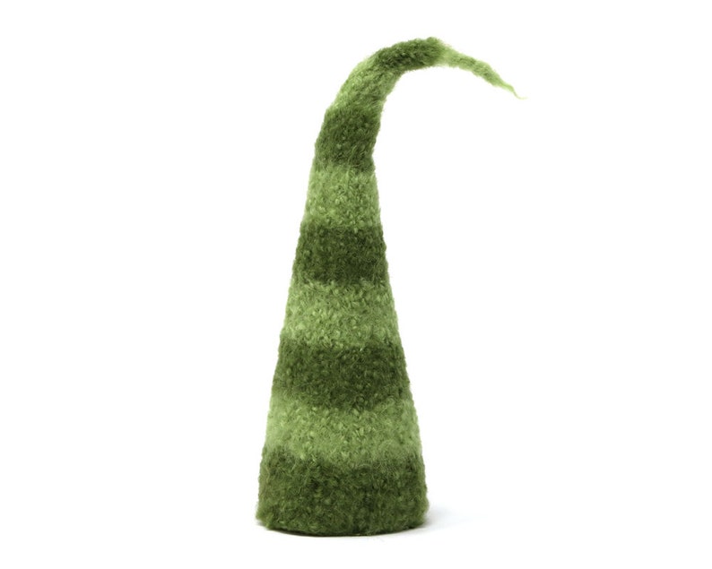 May include: A green felt gnome hat with a pointed tip and striped pattern.