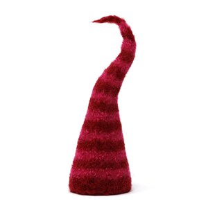 May include: A red felt gnome hat with white stripes. The hat is pointed and has a curled brim.