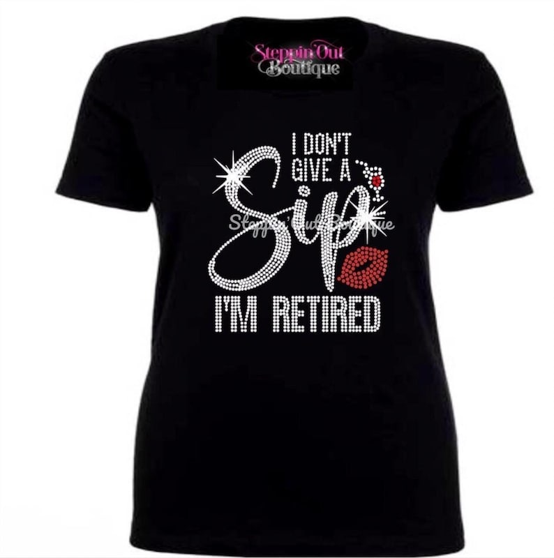 May include: Black t-shirt with a rhinestone design that says "I don't give a Sip I'm Retired" with a red lip graphic.