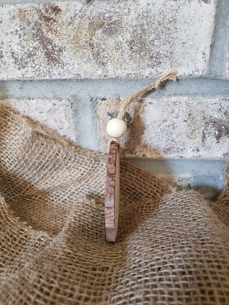 Dog paw wood slice ornament