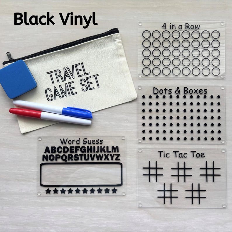 May include: A travel game set with a canvas bag, blue eraser, and markers. Includes acrylic game boards for "4 in a Row", "Dots & Boxes", "Word Guess", and "Tic Tac Toe". The text "Black Vinyl" and "TRAVEL GAME SET" are visible.