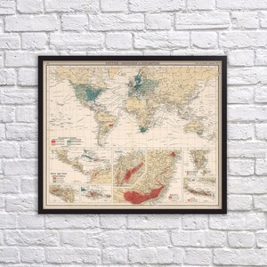 May include: Framed vintage map titled "Coffee - Production & Consumption." The map features a world view with color-coded regions indicating coffee production and consumption. The map is framed in a black border and mounted on a white brick wall.