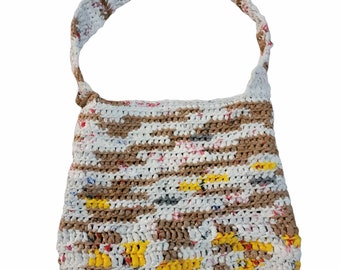 May include: A crocheted handbag with a brown, white, and yellow striped pattern. The bag has a single strap and is made from recycled materials.