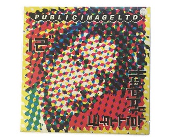 Public Image Ltd, "Warrior", "Happy", remix, vinyl record, 12in single, 1980s, new wave, sex pistols, johnny rotten, john lydon, PIL