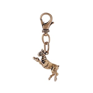 May include: A gold-toned metal keychain featuring a detailed boxer dog figurine. The dog is standing on its hind legs with its front paws raised. The keychain has a spring-loaded clasp.