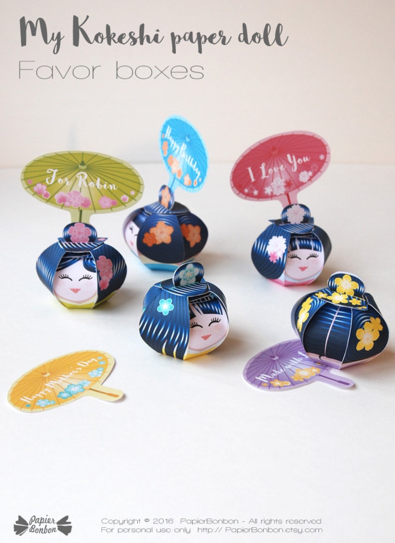 May include: Five colorful Kokeshi paper doll favor boxes with different messages on the top. The messages include "For Robin", "Happy Birthday", "I Love You", "Happy Mother's Day", and "Made with Love".