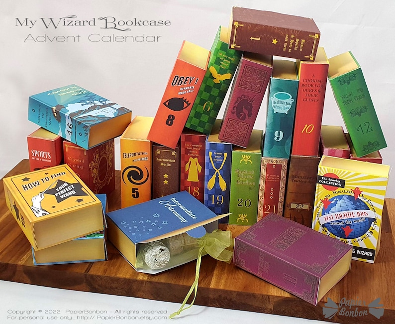 May include: A wizard-themed advent calendar with 24 small boxes shaped like books. Each box has a different title and number. The boxes are stacked in a pyramid shape. The calendar is made of paper and is decorated with a variety of magical themes.