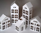 Pack of 5 DIY Putz style glitter houses. 6 quot - 11.8 quot tall unassembled corrugated cardboard houses. Make your own decorative house village