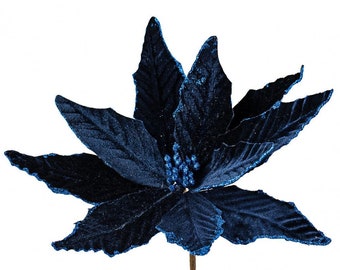 May include: A single blue velvet poinsettia with glitter accents. The poinsettia is a popular Christmas decoration.