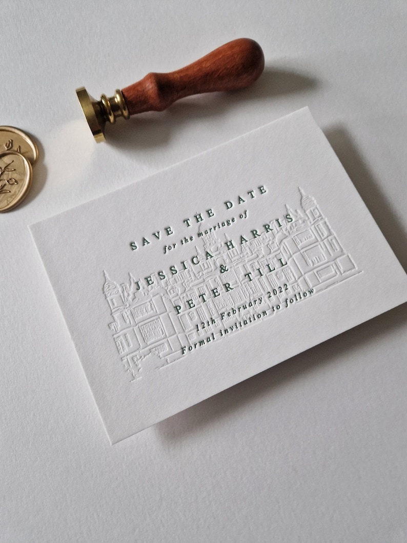 May include: Save the date card with a green embossed illustration of a building and the text "Save the Date for the marriage of Jessica Harris & Peter Till 12th February 2022 Formal invitation to follow."