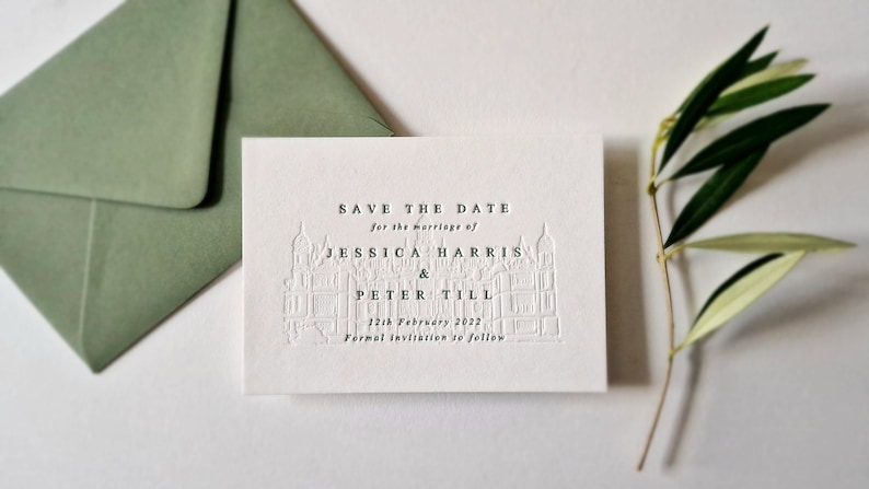 May include: Save the date card with a white background and a black and white illustration of a building. The text reads "Save the Date for the marriage of Jessica Harris & Peter Till 12th February 2022 Formal invitation to follow."