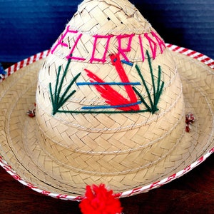 1980&#39;s Florida Straw Decorated Mexican Style Child&#39;s Sombrero, Souvenir Embroidered w Pompoms at Brim Edge. Strap w Bead Excellent VTG Cond.