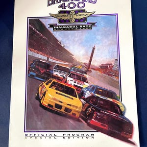 May include: Official program for the Brickyard 400 Inaugural Race at the Indianapolis Motor Speedway, August 6, 1994. The cover features a colorful illustration of race cars speeding around the track.