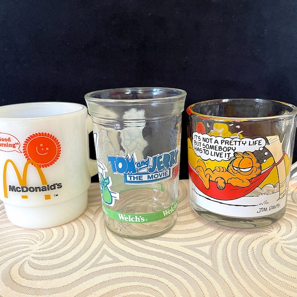 1960's-1980's Tom and Jerry Jar Glass, McDonald's Mug, and Garfield Mug, All for One Price. All in excellent Condition. 4"H and 3-1/2"H