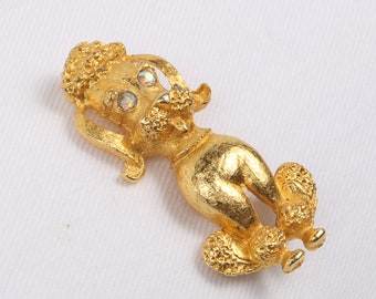 60's Dog Brooch, Gold Tone Sitting Poodle Brooch. Textured 3D with Aurora Borealis Eyes. Excellent Condition. Rollover Clasp.