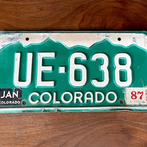 1987 Colorado State License Plate, Green and White, Some Bends along Edges, No Rust