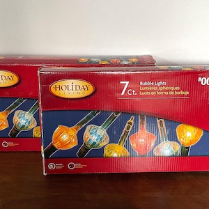 VTG Holliday Living 7 luci a bolle, confezione originale, 2 scatole vendute insieme, eccellenti condizioni mai usate, rosso trasparente giallo rosso verde