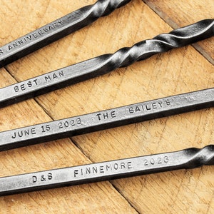 Examples of custom personalization engravings on hand forged steel fire tools.