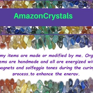 May include: A collection of multicolored tumbled stones arranged in horizontal bands. The text AmazonCrystals appears in green on a purple background. Below, text reads: All my items are made or modified by me. Orgone items are handmade and all are energized with magnets and solfeggio tones during the curing process.to enhance the enerav.