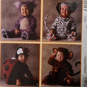 May include: A McCall's Costumes sewing pattern envelope for the Tom Arma Collection, number 8897, size 3. The front displays four infant costumes: a purple koala, a black and white dalmatian, a red and black ladybug, and a brown monkey.