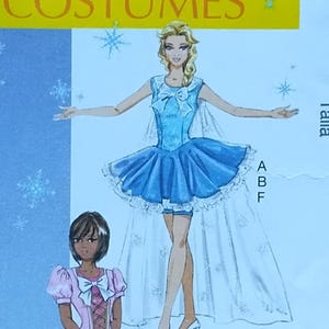 May include: McCall's Costumes sewing pattern M7101. The pattern features illustrations of four different costume designs, including a blue dress with a bow, a pink dress, and a green dress. The pattern size is AX5 (4-6-8-10-12).