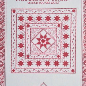 May include: A white paper with a red star quilt design. The text "PARAMOUNT STARS" and "96 INCH SQUARE QUILT" are at the top. The design includes a central star pattern and a border with star shapes. The designer's information is at the bottom.