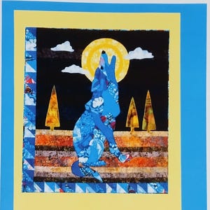 May include: A quilt pattern titled La Luna Lobo featuring a blue collage-style wolf howling at a yellow moon against a black sky with white clouds and orange trees. The bottom includes the text bj DESIGNS & PATTERNS, 515.225.8622, www.bjdesignsandpatterns.com, 4372 Ashley Park Drive, West Des Moines, IA 50265.