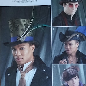 May include: Simplicity pattern 8713 features various steampunk-inspired hat designs. The image showcases a top hat with floral detailing, a blue band, and a feather. Other hats include goggles and a wide-brimmed hat with embellishments. The pattern includes sizes S-L.