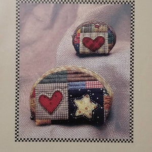 May include: Image of two quilted Country Pouches. The pouches are made of patchwork fabric with a red heart and a star applique. The text "Kimie's Quilts" and "Country Pouch" are visible. Item #101 is also displayed.
