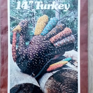 May include: A vintage patchwork turkey pattern and instructions by Yours Truly. The pattern creates a 14-inch turkey with colorful, patterned fabric feathers. The turkey is set against a forest backdrop.