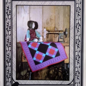 May include: A white ceramic mug with a black handle and the text "But First, Coffee" in a black, handwritten-style font. The mug is on a white surface.