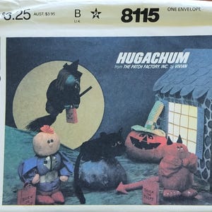 May include: McCall's sewing pattern envelope featuring a Halloween scene with a witch on a broom, a black cat, a pumpkin, and other whimsical characters. The text "HUGACHUM" is displayed prominently.