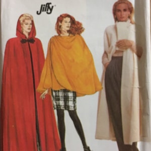 May include: Simplicity sewing pattern 7016 featuring cape designs. The pattern includes a red hooded cape, an orange cape, and a long cream-colored coat. The image shows the pattern cover with the Simplicity and Jiffy logos.