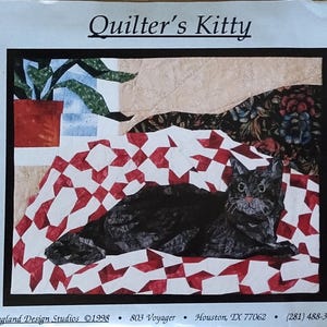 May include: A quilting pattern titled "Quilter's Kitty" featuring a black cat lying on a red and white checkered quilt. The image includes a plant in a red pot and floral patterned fabric. The package includes iron-on templates.