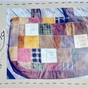 May include: A patchwork sewing bag with a variety of fabric squares in shades of pink, brown, blue, and yellow. The bag measures 21" x 15" and has a handle. The words "my sewing bag" are written on the side.