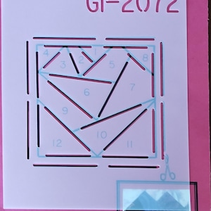 May include: Pink stencil with the text "GI-2072" and "Crazy Heart 3". The stencil features a geometric heart design with numbered sections. A small, completed heart sample is in the lower right corner.