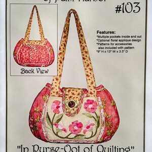 May include: A pattern for a floral applique purse, with a back view image. The purse has multiple pockets and is 9 inches high, 13 inches wide, and 3.5 inches deep. The text reads "Purse-O-Nalities of Palm Harbor #103".
