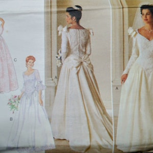 May include: A vintage wedding dress pattern featuring three different bridal gown designs. The dresses include long sleeves, a-line skirts, and decorative details. The pattern shows the front and back views of the dresses.