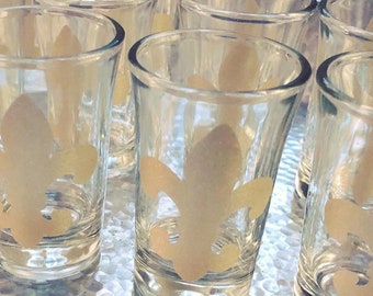 Fleur de Lis shot glasses by the dozen