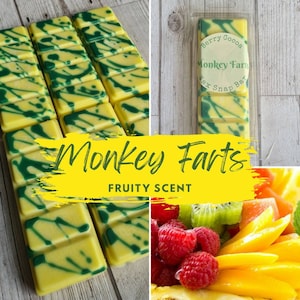 May include: A yellow and green wax melt snap bar with the text "Berry Cocoa Monkey Farts Wax Snap Bar" and "Monkey Farts FRUITY SCENT". The bar is divided into 12 squares and is surrounded by a white background.