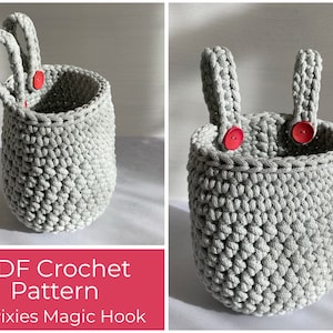 May include: A grey crocheted hanging basket with two loops and red buttons. The basket is made with a textured stitch and has a round shape. PDF Crochet Pattern by Pixies Magic Hook.