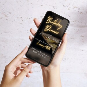 May include: A black smartphone screen displaying a birthday dinner invitation with gold text. The invitation reads "Birthday Dinner", "Friday, January 26, 2024 at 7 PM", "Join us for dinner and celebrate Lana's 40th", "12345 Anywhere St., City", and "RSVP 555-555-555".