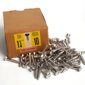 May include: A box of 10 nickel-plated screws, 1 1/4 inches long, with a label that reads "Brass Laiton Latón 1 1/4" and "Messing Messing Kopperen 10 glanz-vernickelt".