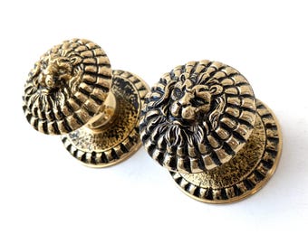 Lion head door knobs, solid brass. New old stock.