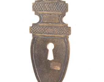 Antique Brass Pressed Keyhole Cover, escutcheon.