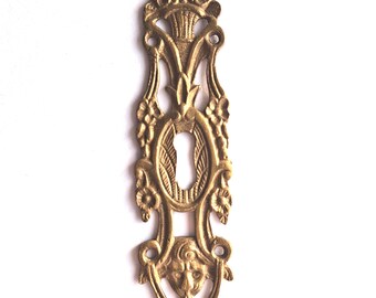 Antique brass escutcheon, keyhole cover, empire.